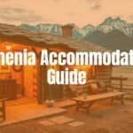 A cozy Armenian guesthouse with traditional decor, nestled in the countryside, warm lighting, scenic mountain backdrop, inviting and peaceful atmosphere, realistic.