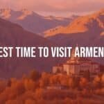 Scenic view of Armenia in autumn, golden landscapes with mountains, historic monastery in the background, warm sunlight, peaceful and inviting atmosphere, realistic.