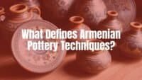 Traditional Armenian pottery pieces with intricate patterns, warm earthy colors, and cultural symbols, arranged on a rustic wooden table, natural daylight, detailed and realistic.