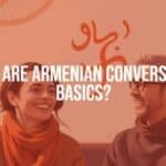 A friendly conversation scene in Armenia, two people smiling and chatting, Armenian alphabet letters floating in the background, warm and inviting atmosphere, realistic style.